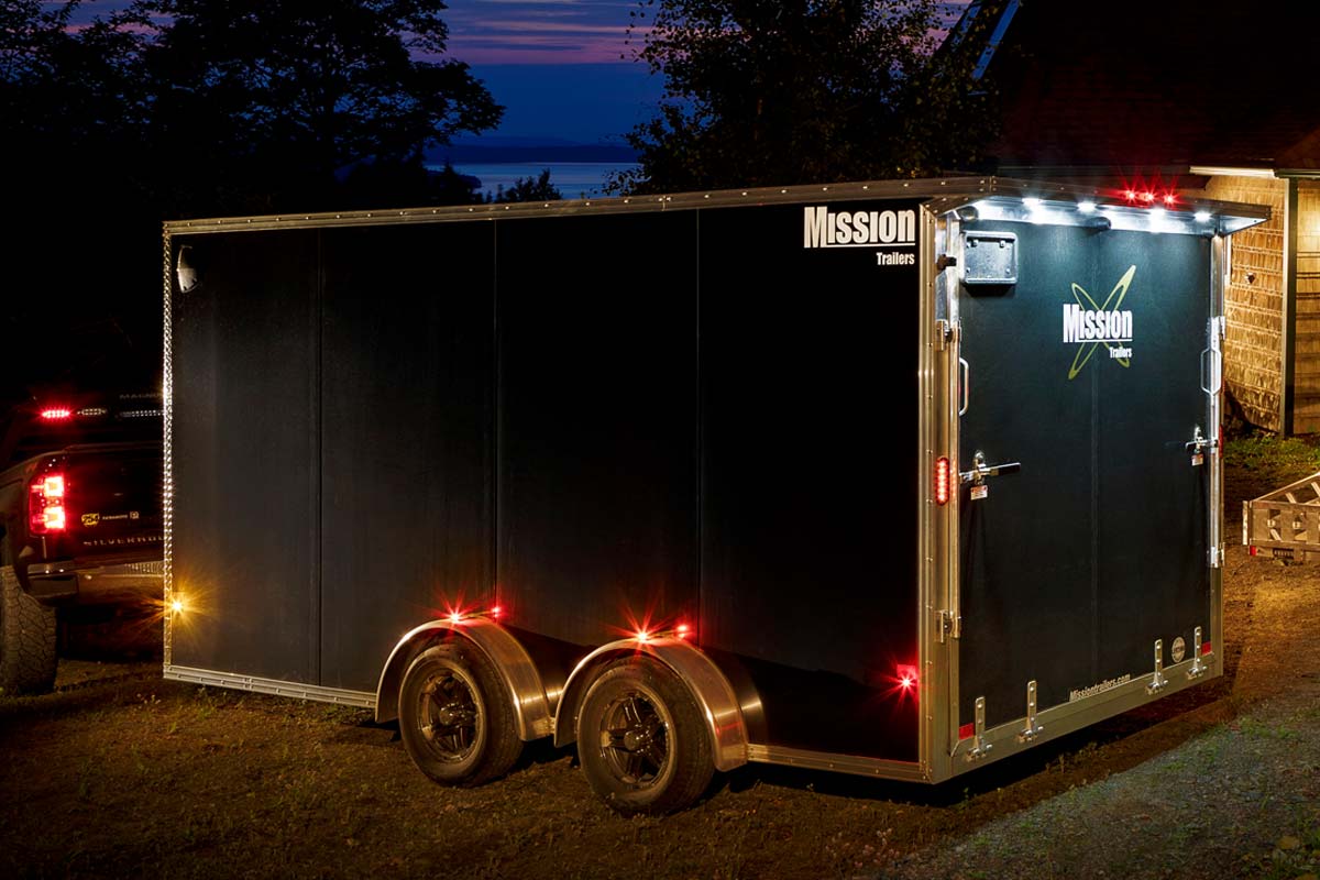 Black Enclosed Cargo Trailer With Rear Lights On In Dark