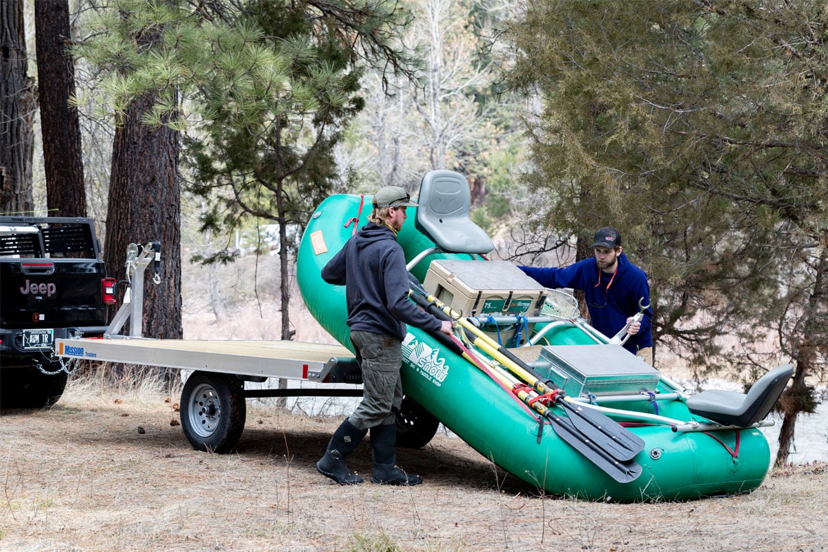 Guys Unloading Raft From Raft Trailer