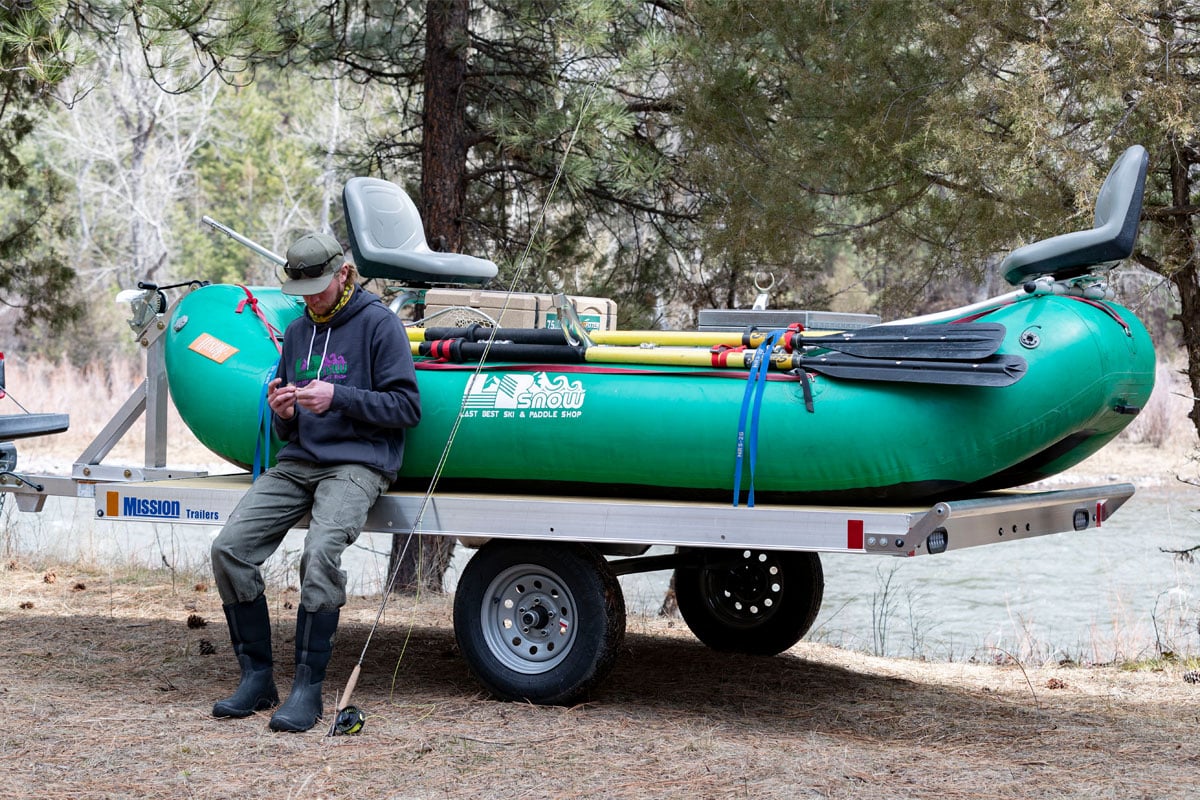 Man Sitting On Raft Trailer