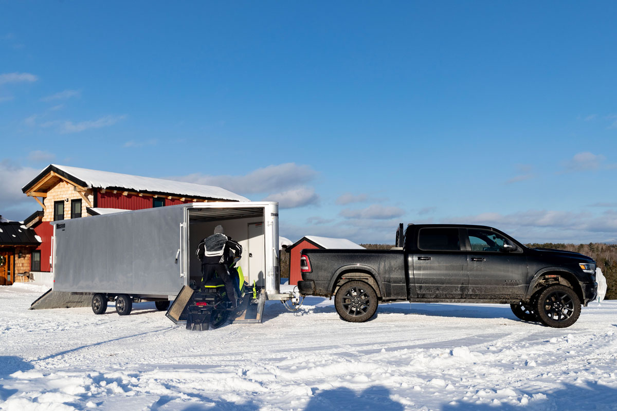 Snowmobile Going In Front Ramp Door On Enclosed Deckover 6.5-Height Snow Trailer